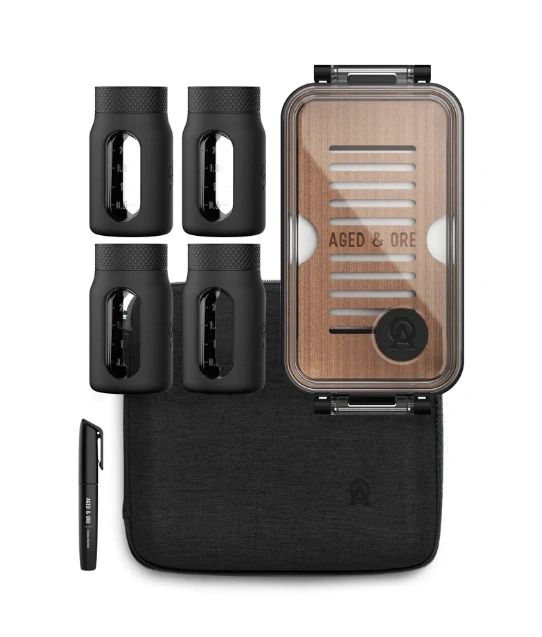 Whiskey aging kit with containers and case.