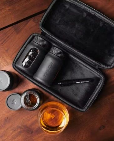 Travel grooming kit with accessories on table.